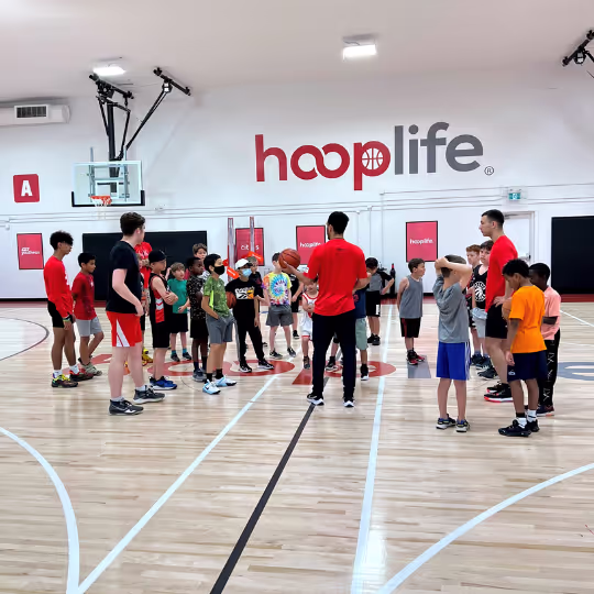 Coach explaining something to kids