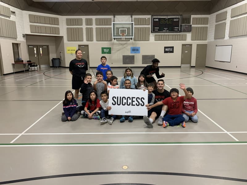 The Whitecap clinic group holding the SUCCESS sign
