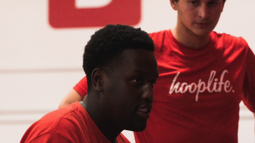 A HoopLife coach working one on one with a player at the HoopLife Centre in Regina