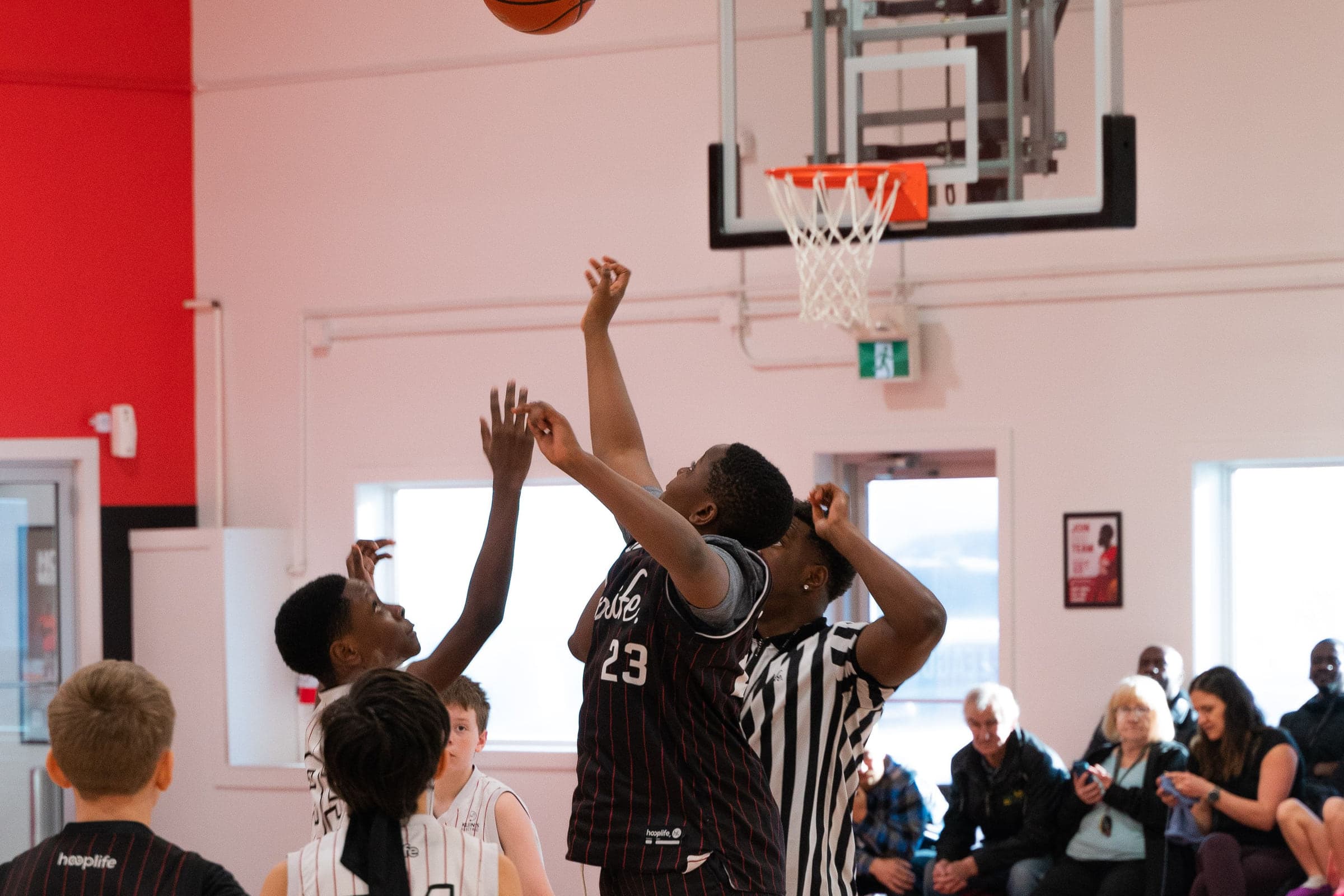 Older players contesting a shot during a game at the HoopLife Centre in Regina