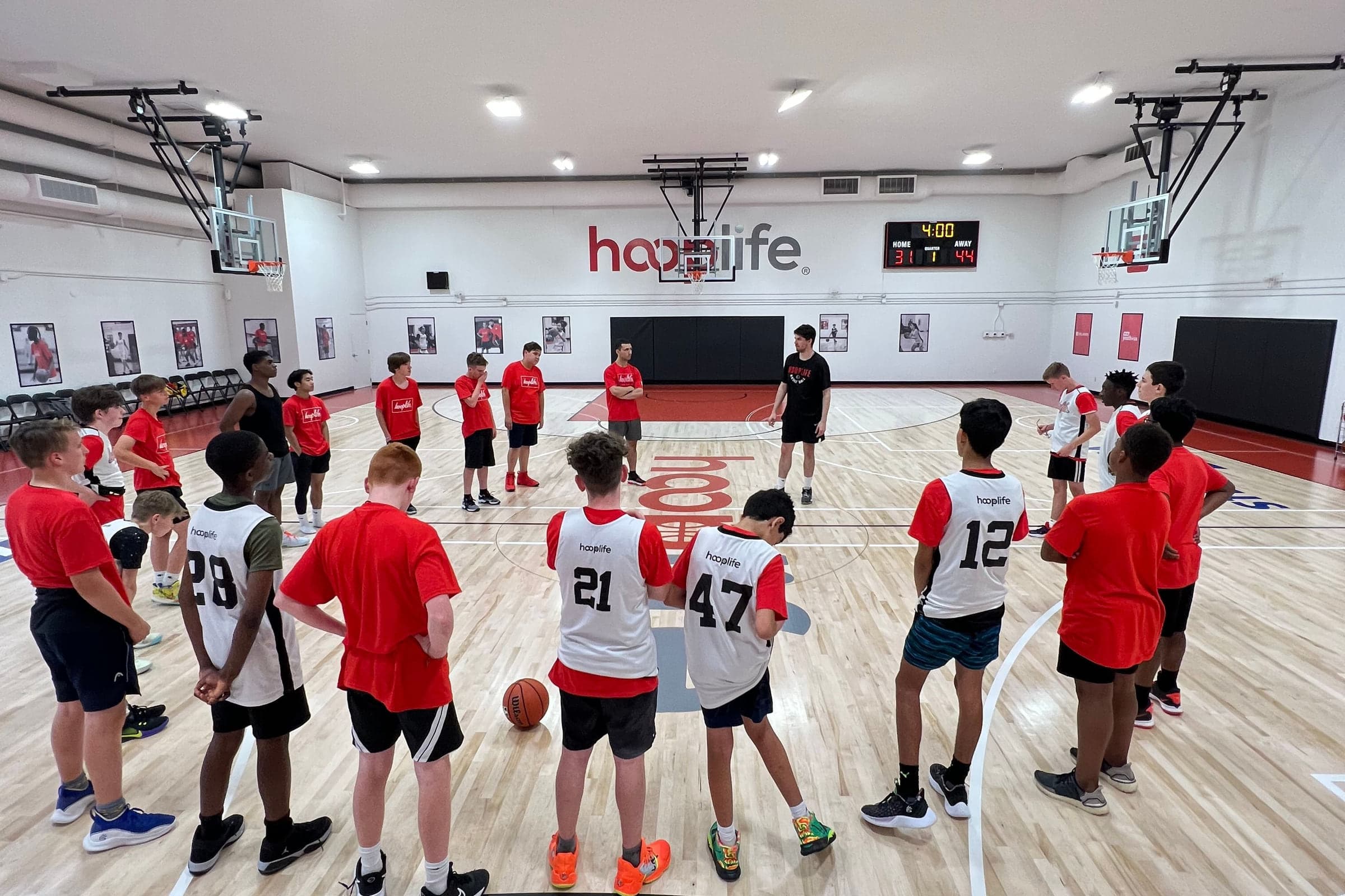 A HoopLife camp group spread across the court at the HoopLife Centre in Regina