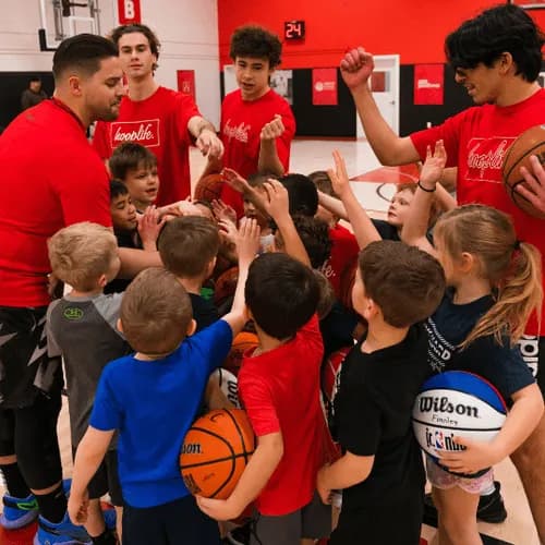 A HoopLife League team huddled up with their coaches