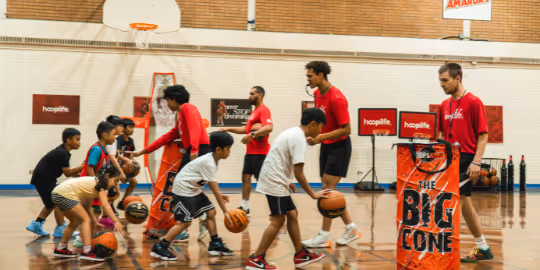 Kids learning how to dribble