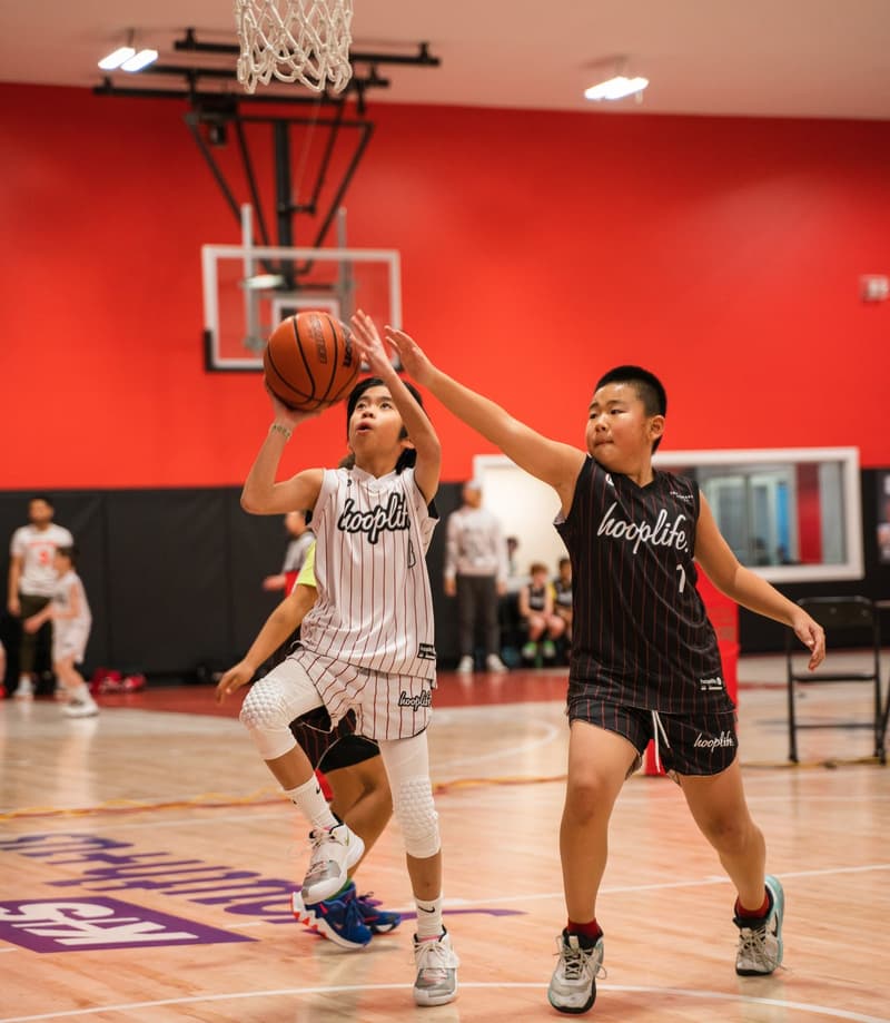 A contested finish at the rim during a 3x3 game