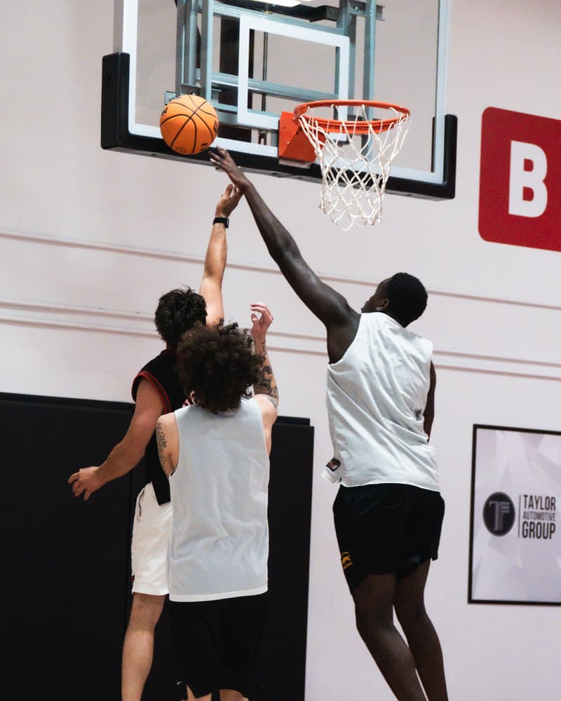 Adult league players battling for a rebound at the rim