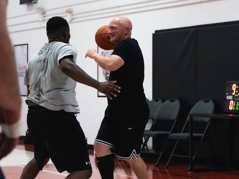 An adult league player locked in on defence