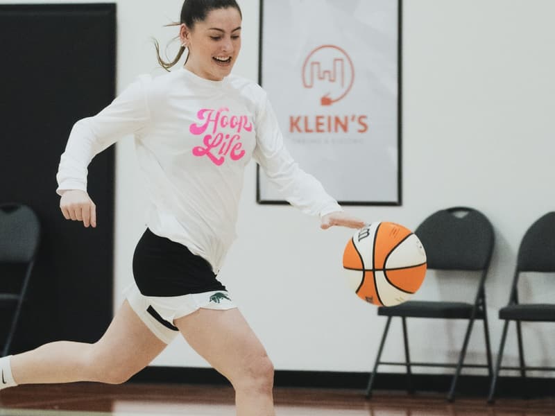 A player pushing the ball on the break