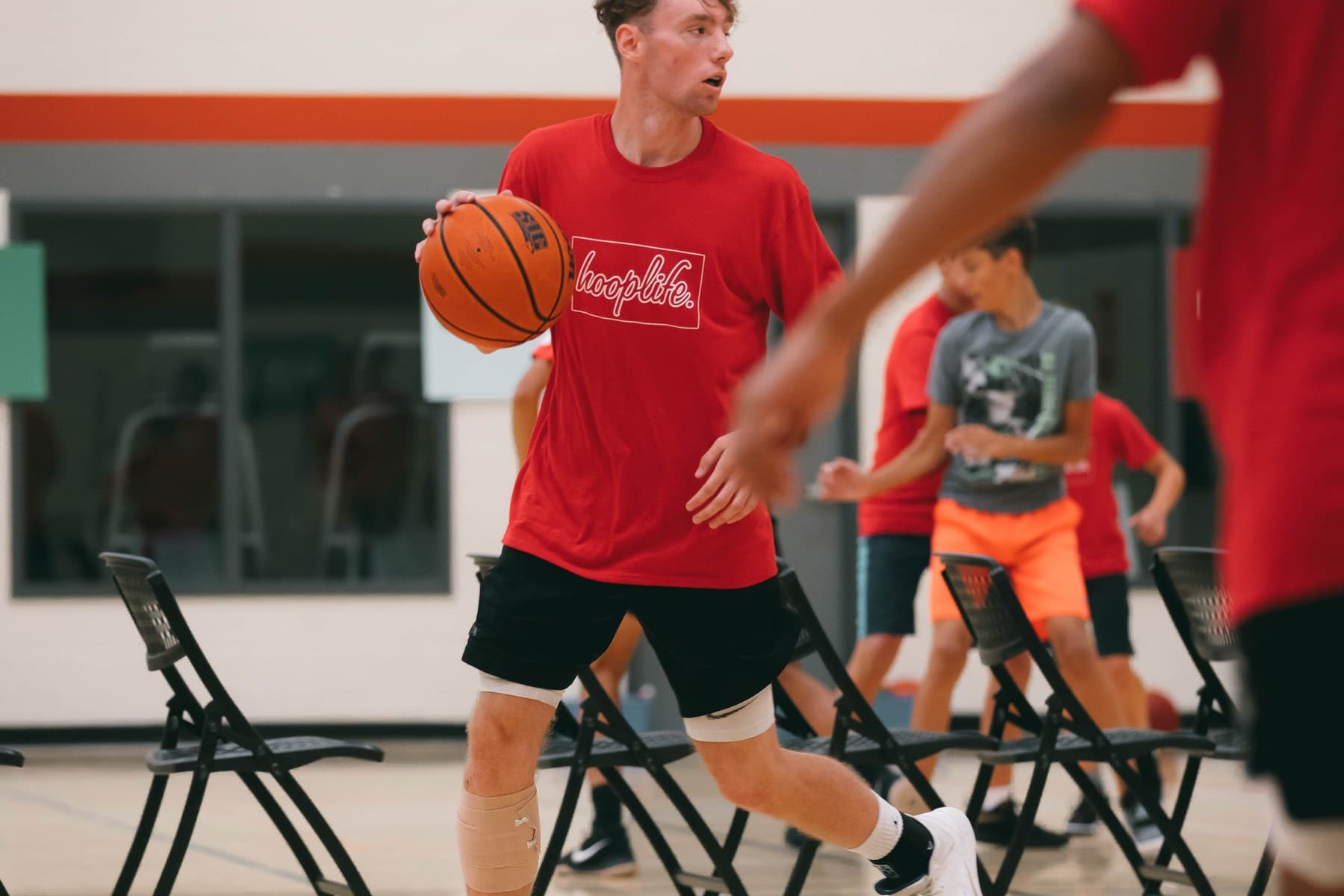 A HoopLife player driving hard to the hoop during a Regina session