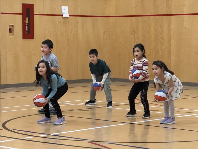 Young players in ready stance at the Chesterfield Inlet clinic in Nunavut