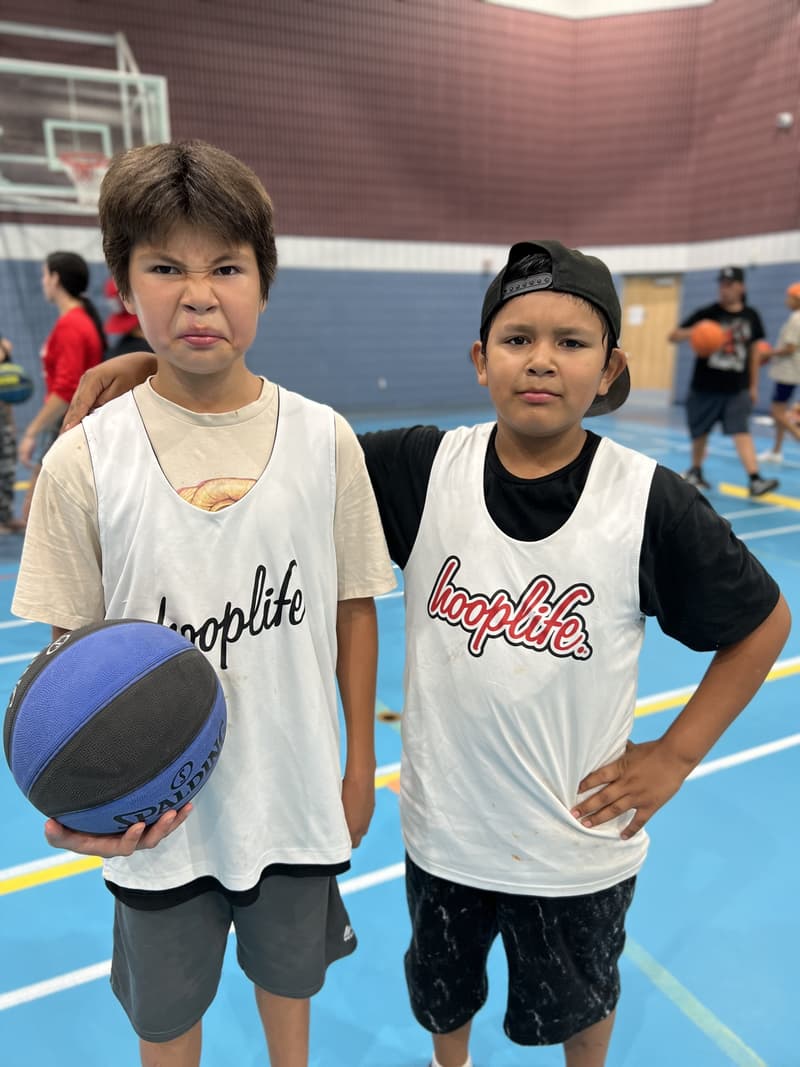Teammates with their basketballs at the Kawacatoose clinic
