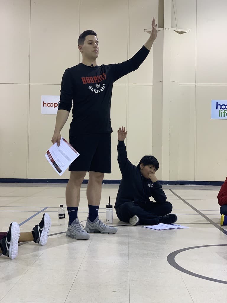 A HoopLife coach taking questions during the White Bear character session