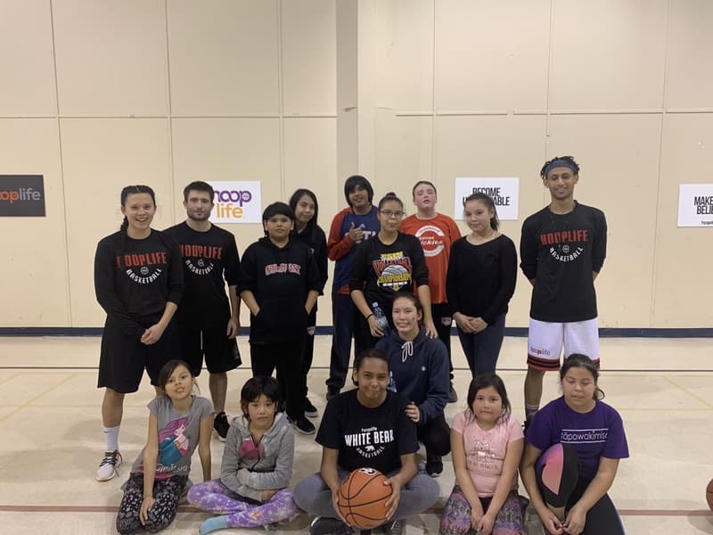 White Bear kids in their White Bear Basketball shirts with the HoopLife coaching crew