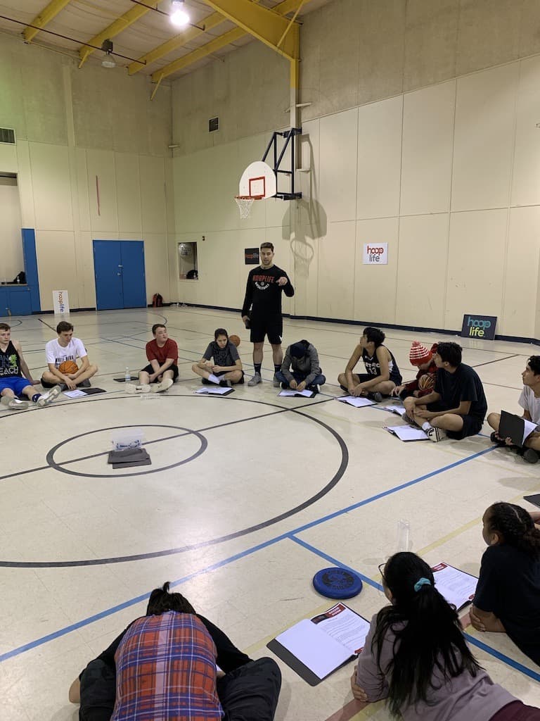 White Bear youth working through their Success System booklets in a circle
