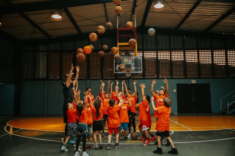 Kids celebrating mid-game at the HoopLife clinic in Costa Rica
