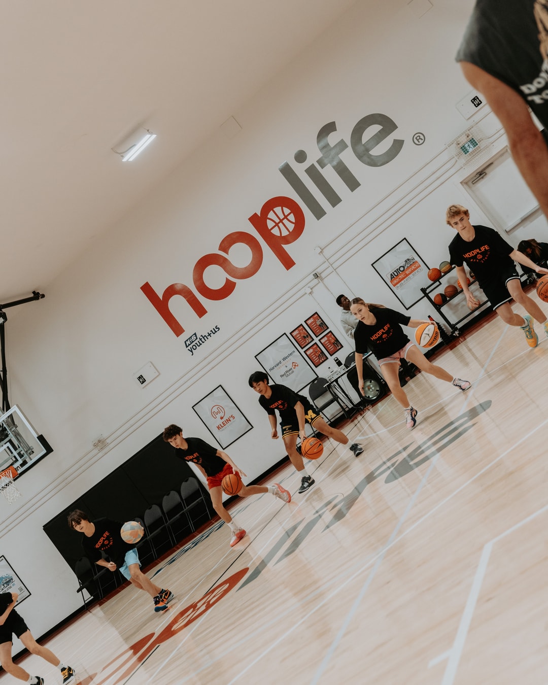 The HoopLife court in use under the hooplife wall