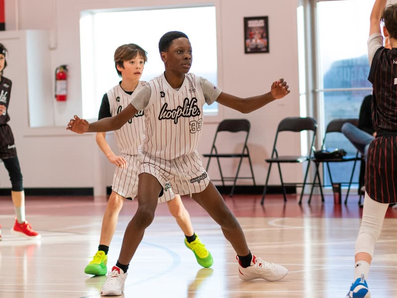 A HoopLife League player bringing the ball up the floor