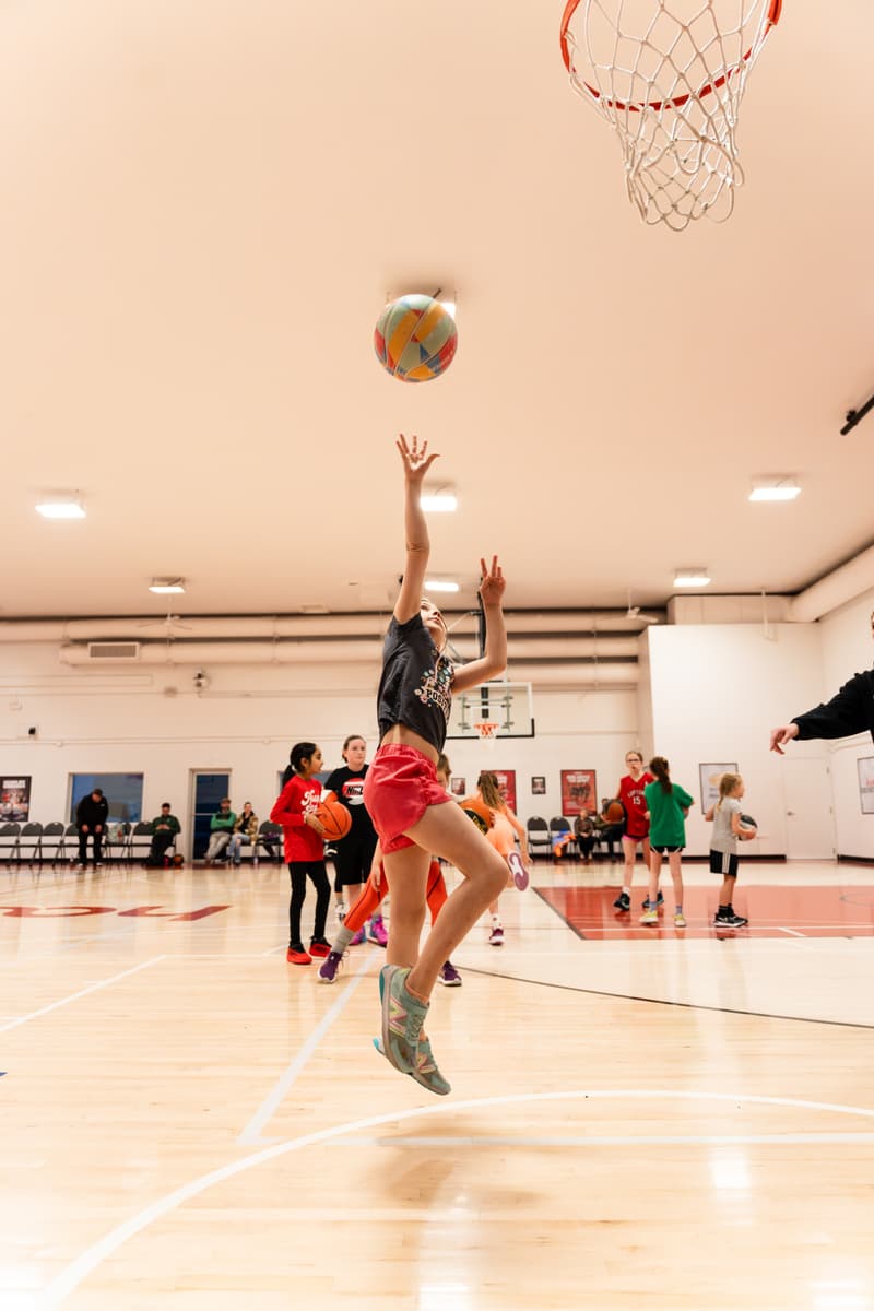 A girl getting shots up at open gym