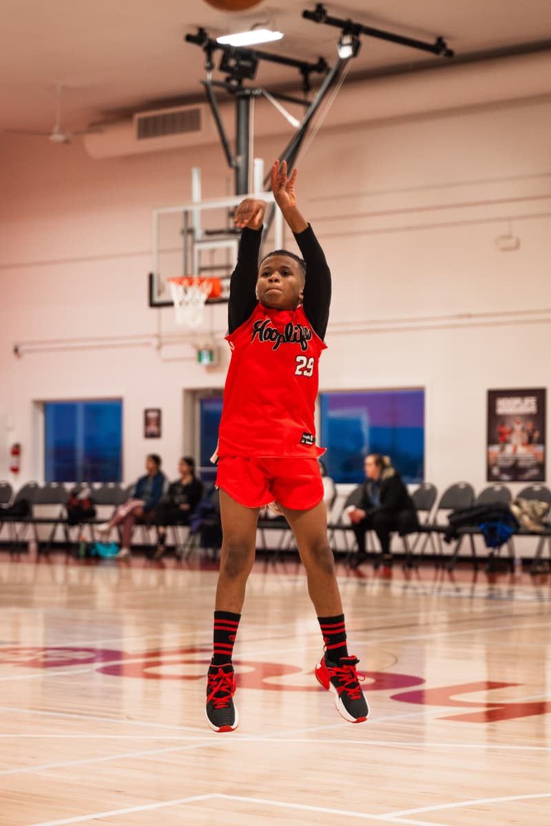 A young player shooting during open gym