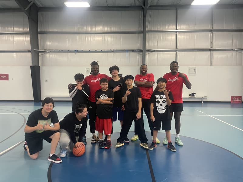 HoopLife coaches with players on the court at the Swan River clinic