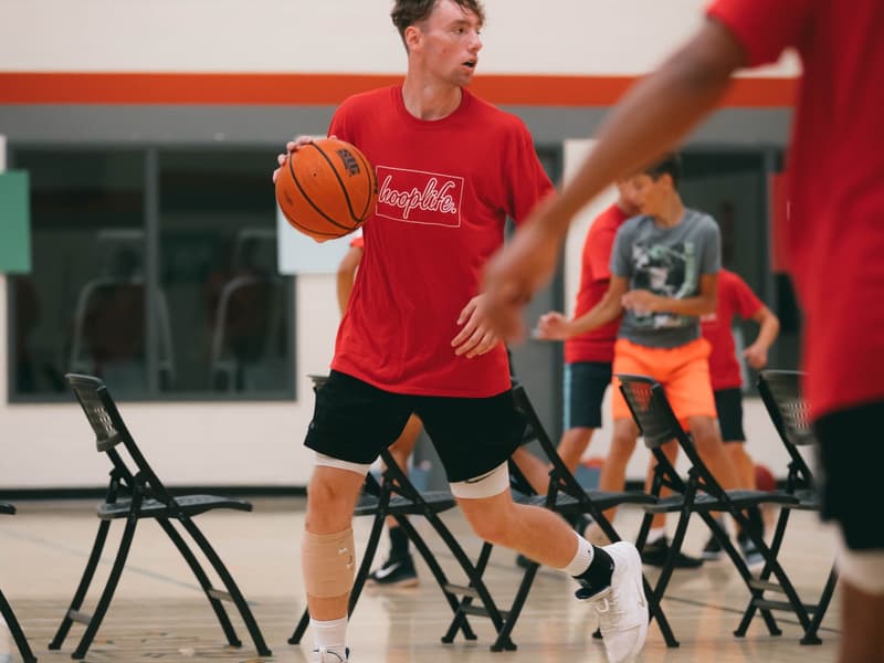 A player finishing at the rim in traffic