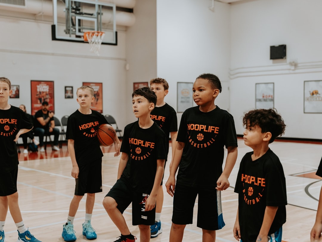 A group of players between drills at a HoopLife training session