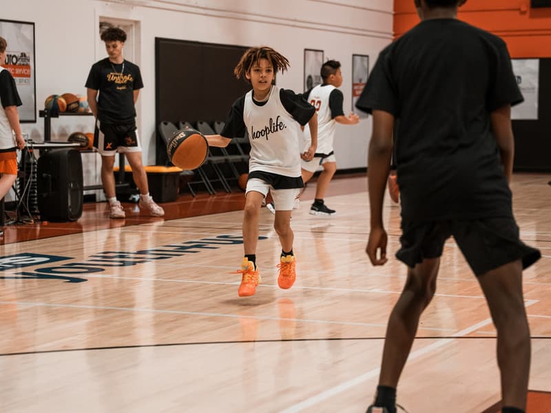 Players running a pickup game at the HoopLife Centre