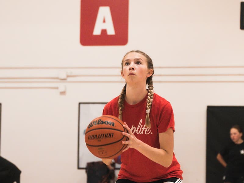 A player working on her shooting form