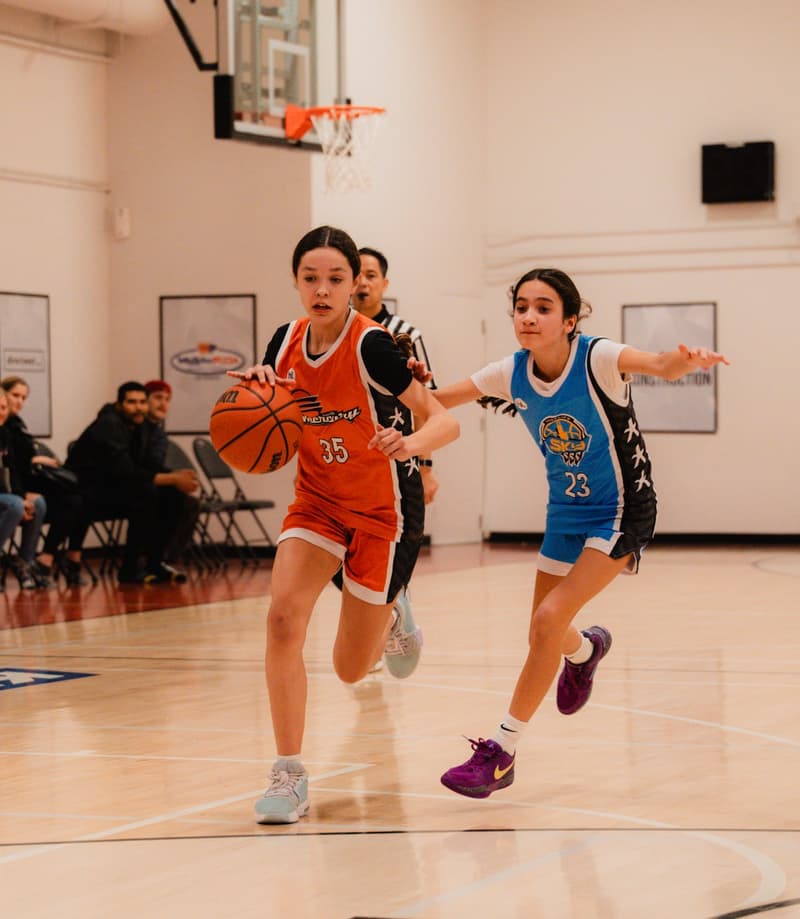 A girls division player driving to the rim in Regina