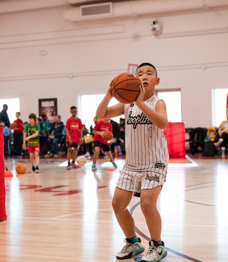 A member working on shooting form at open gym
